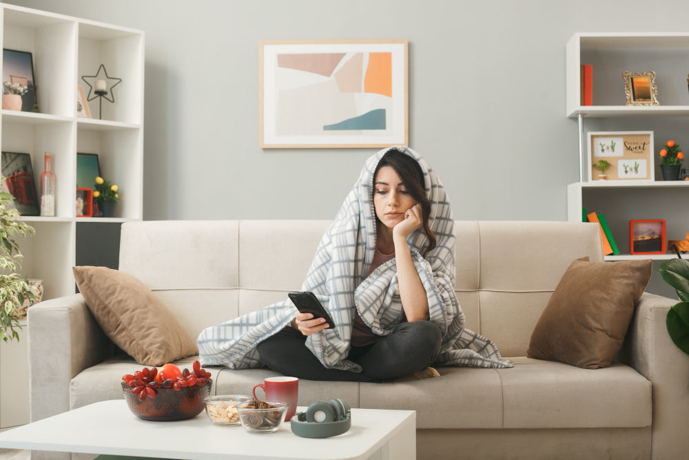 Moody living room with deep walls and soft anthracite sofa