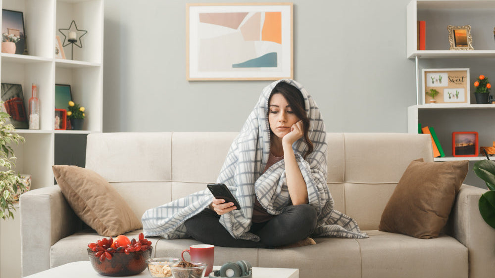 Moody living room with deep walls and soft anthracite sofa