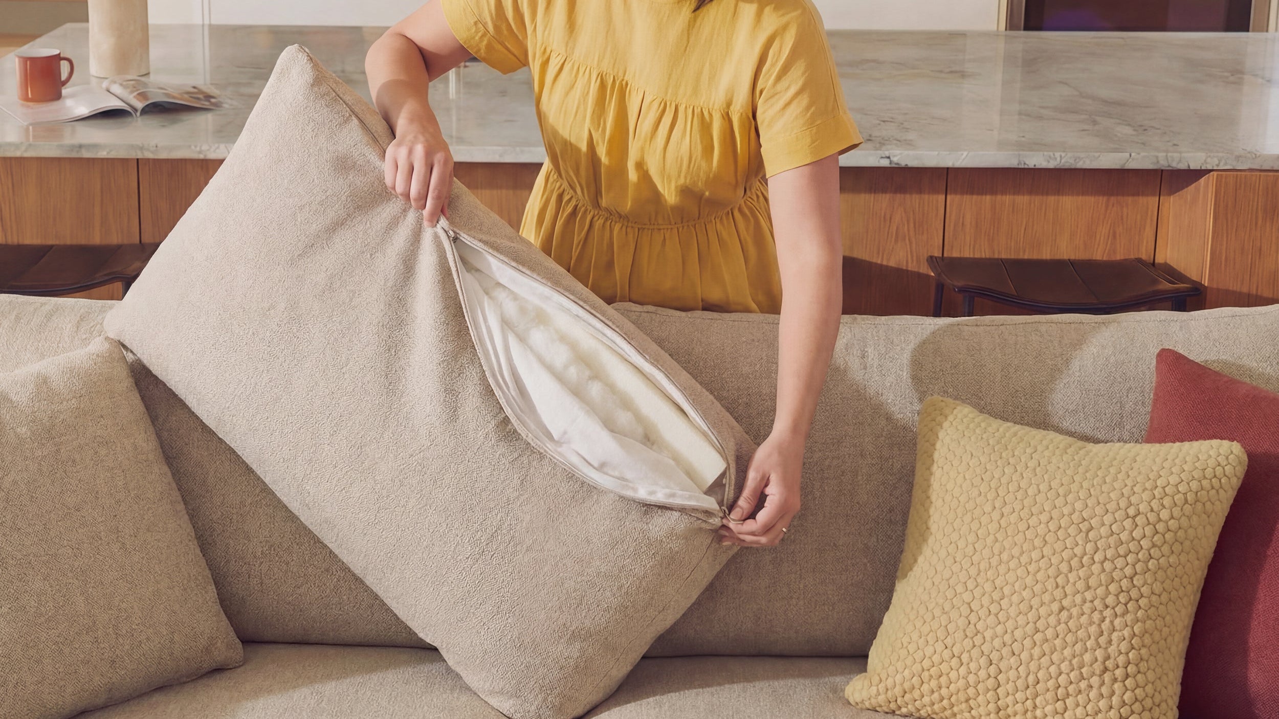 Layered neutral living room with textured furniture