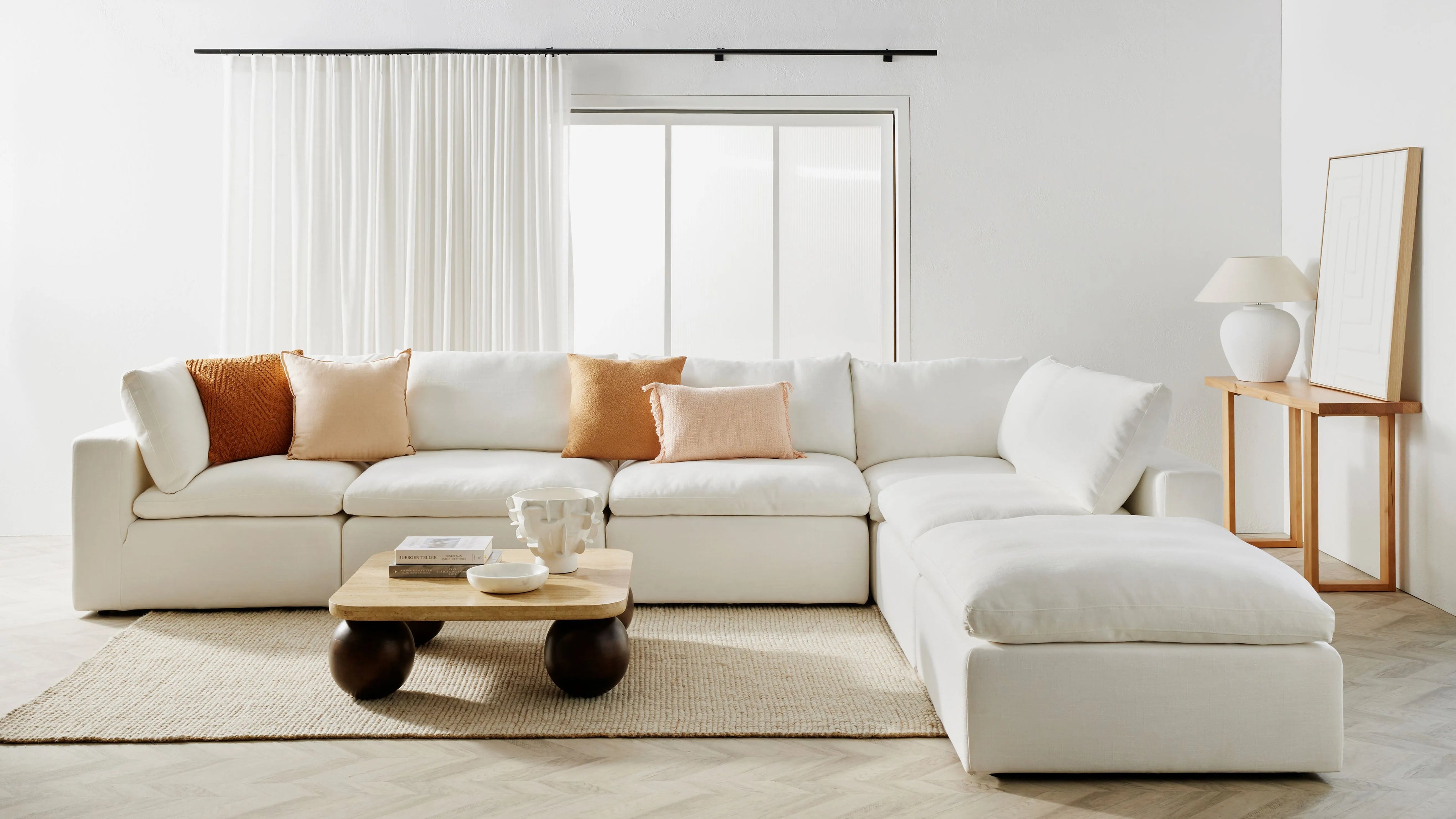 Beige L-Shaped sofa in clean white room