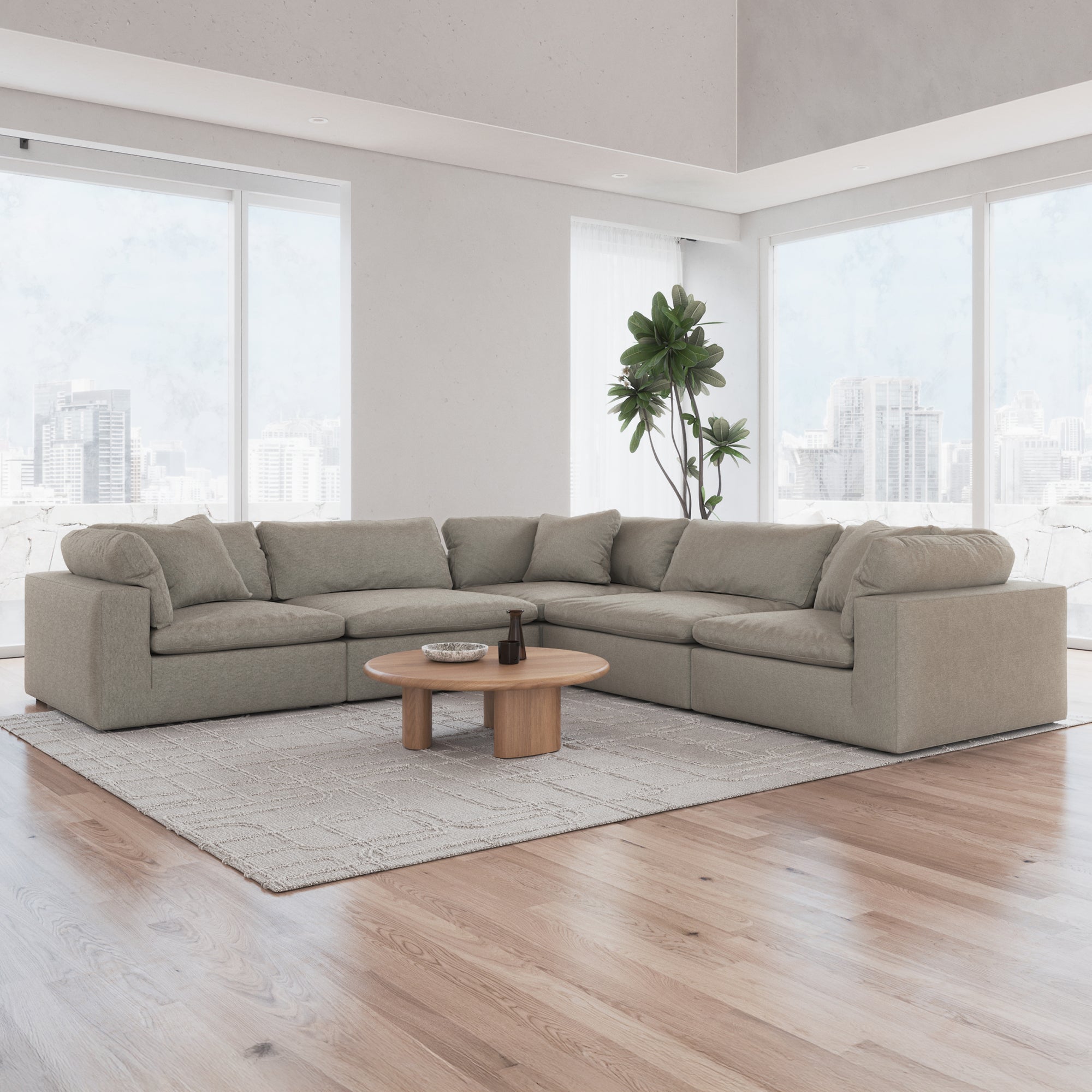 Sofatica 5-seater L-shaped cloud couch in khaki in a modern living room