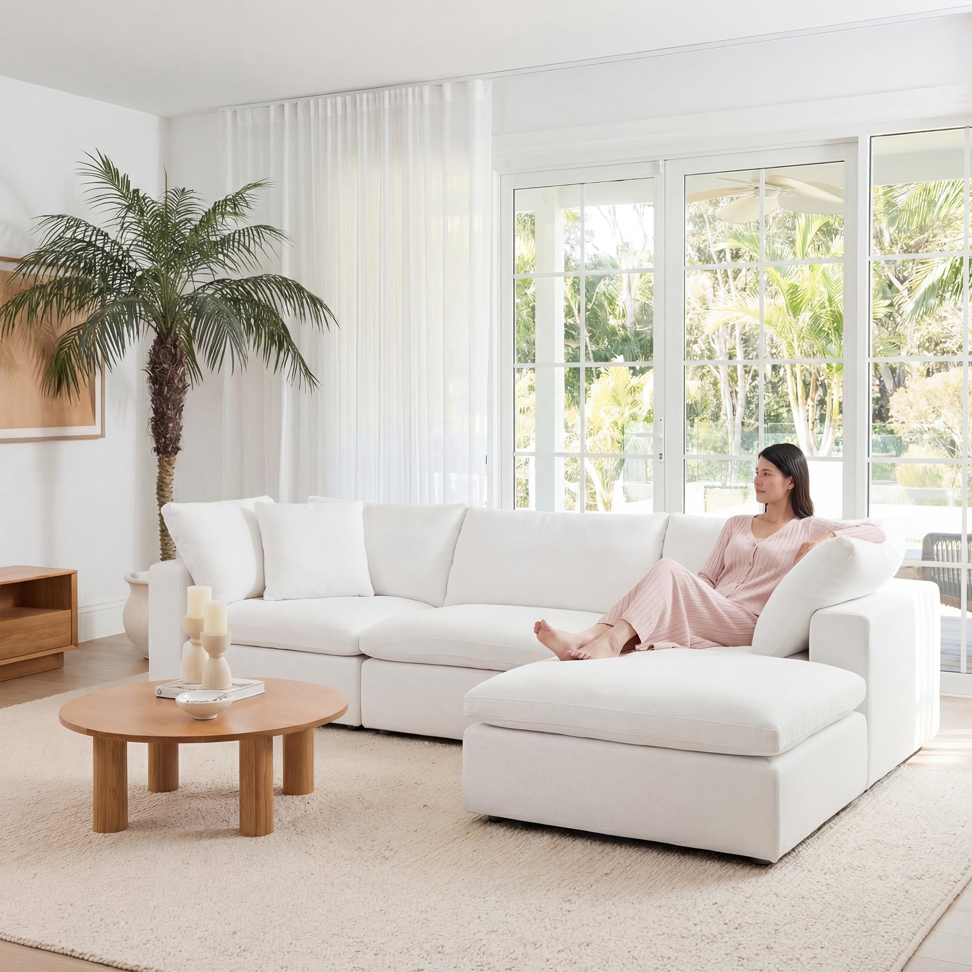 Open plan living room zoned with rug and floating sofa