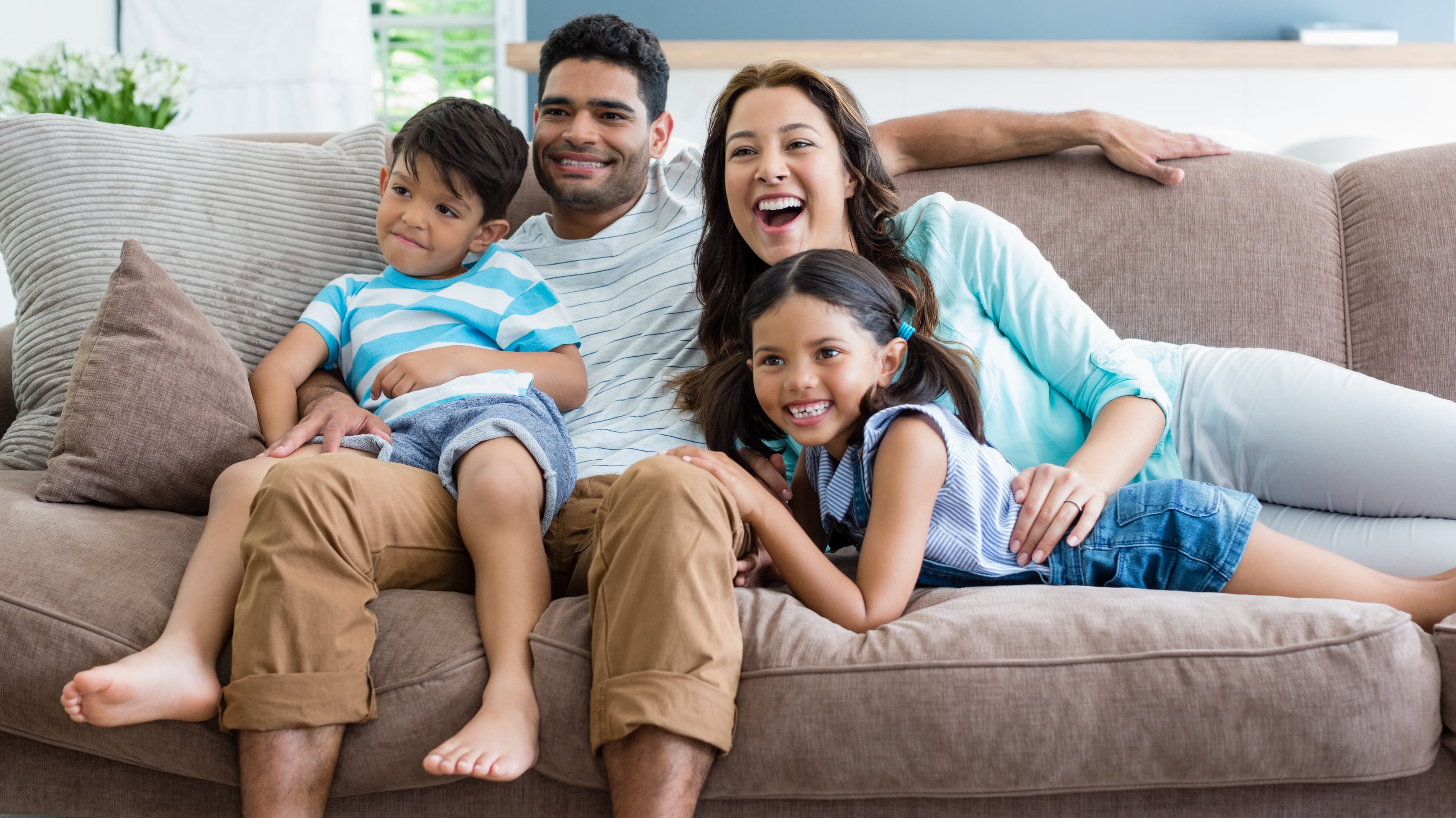 Nursery reading corner with glider and soft lighting