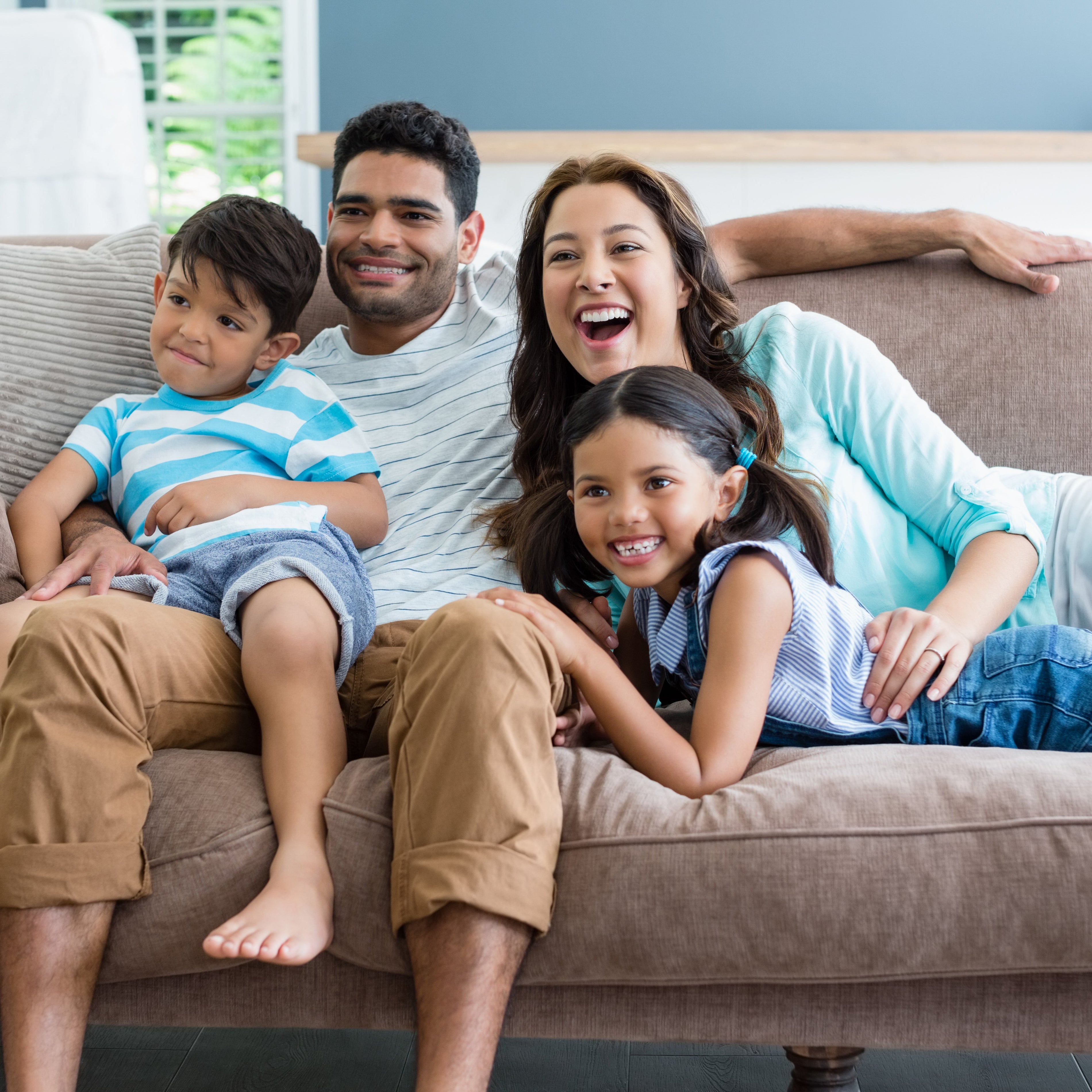 Nursery reading corner with glider and soft lighting