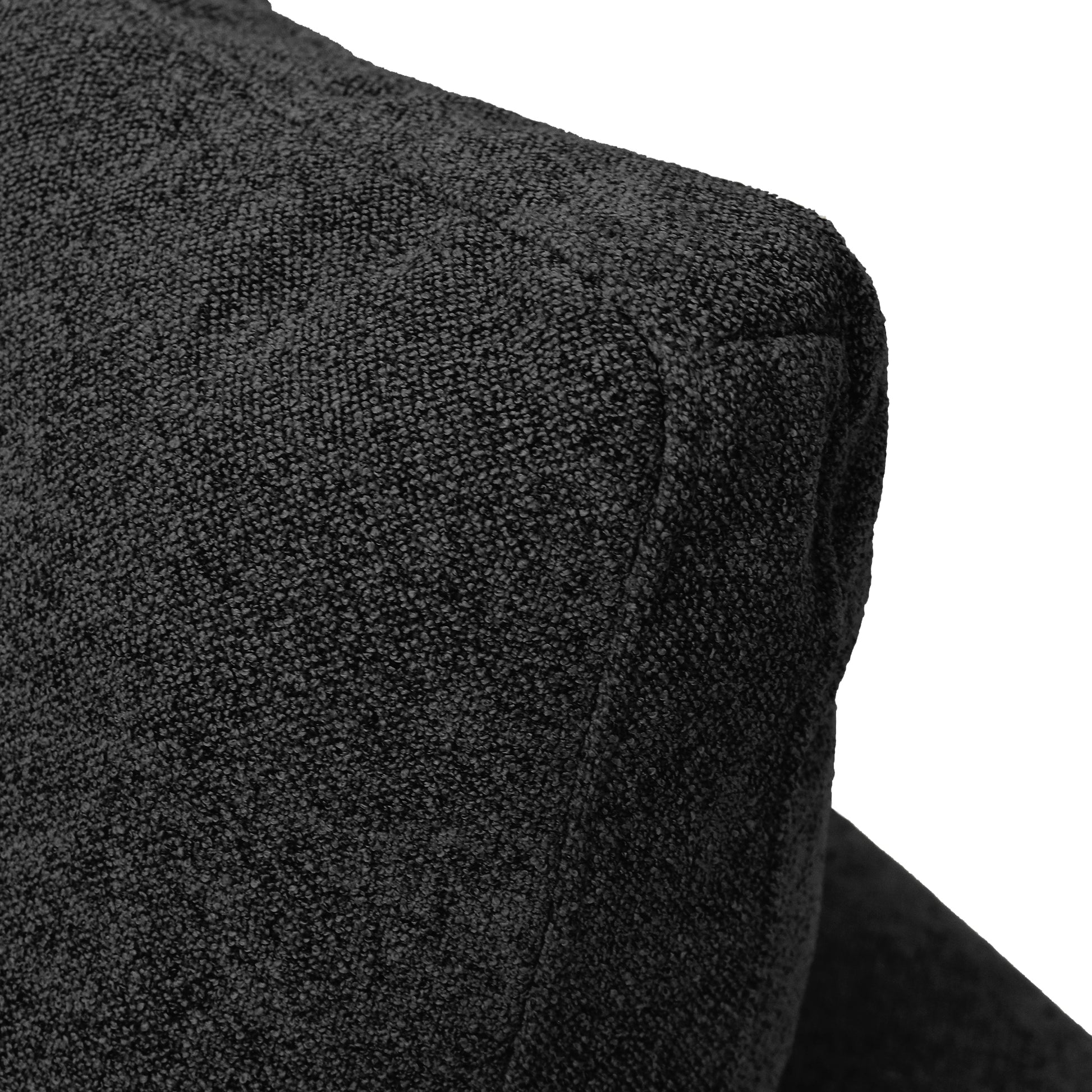 Close-up of a black textured fabric corner from the modular HavenlyCloud® 3-Seater L-Sectional Couch, highlighting its sleek design and removable covers.