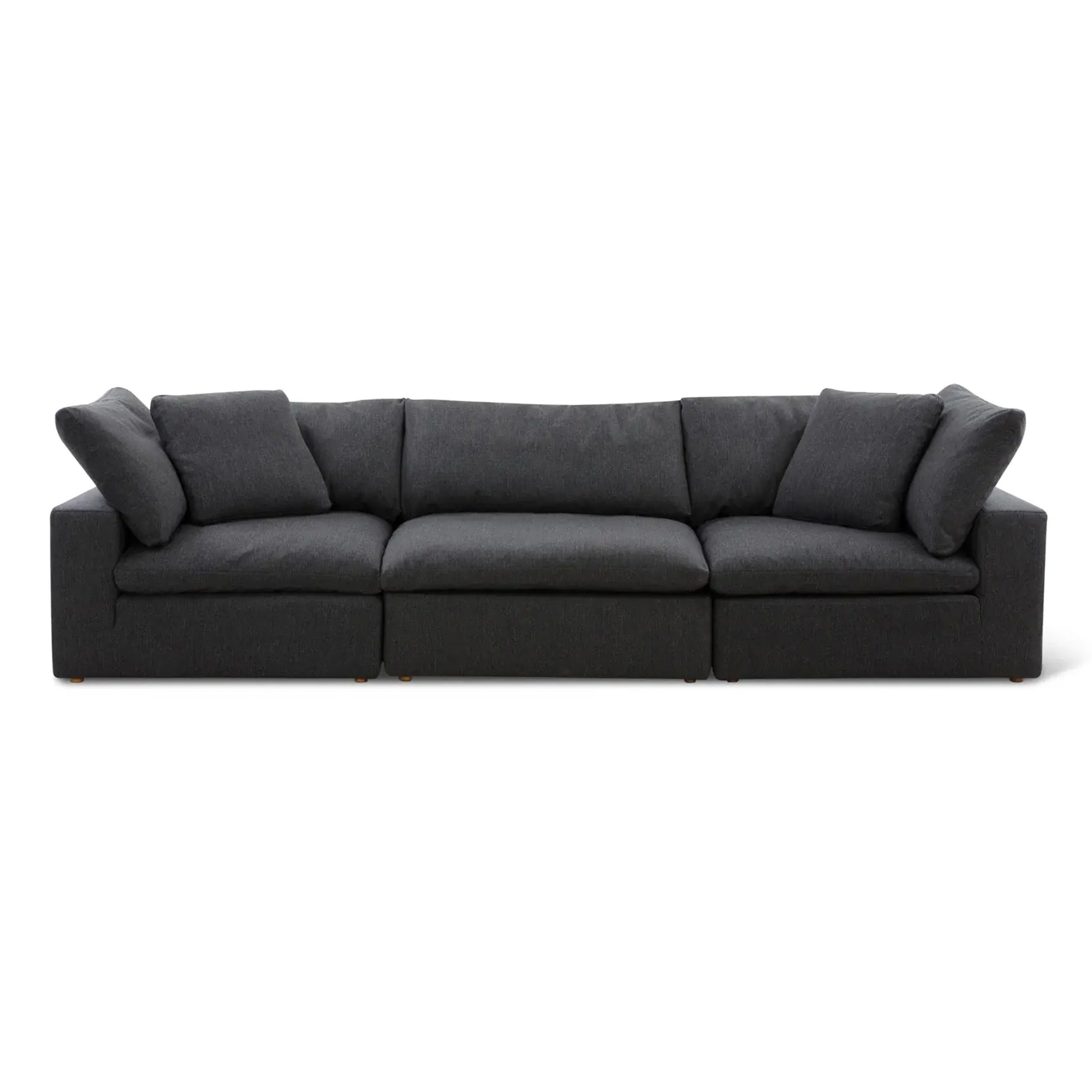 A black Sofatica® Modular 3-Seater Cloud Couch in performance fabric, featuring three seat cushions and four large back cushions, with a handcrafted solid birch wood frame, set against a plain white background.