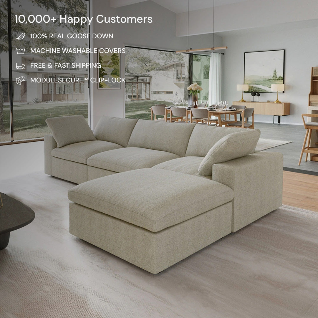 The CloudForm™ 3-Seater + Ottoman Modular Sofa in beige sits in a modern living room with large windows and a dining area behind; product features like removable fabric covers are highlighted in the top left corner.