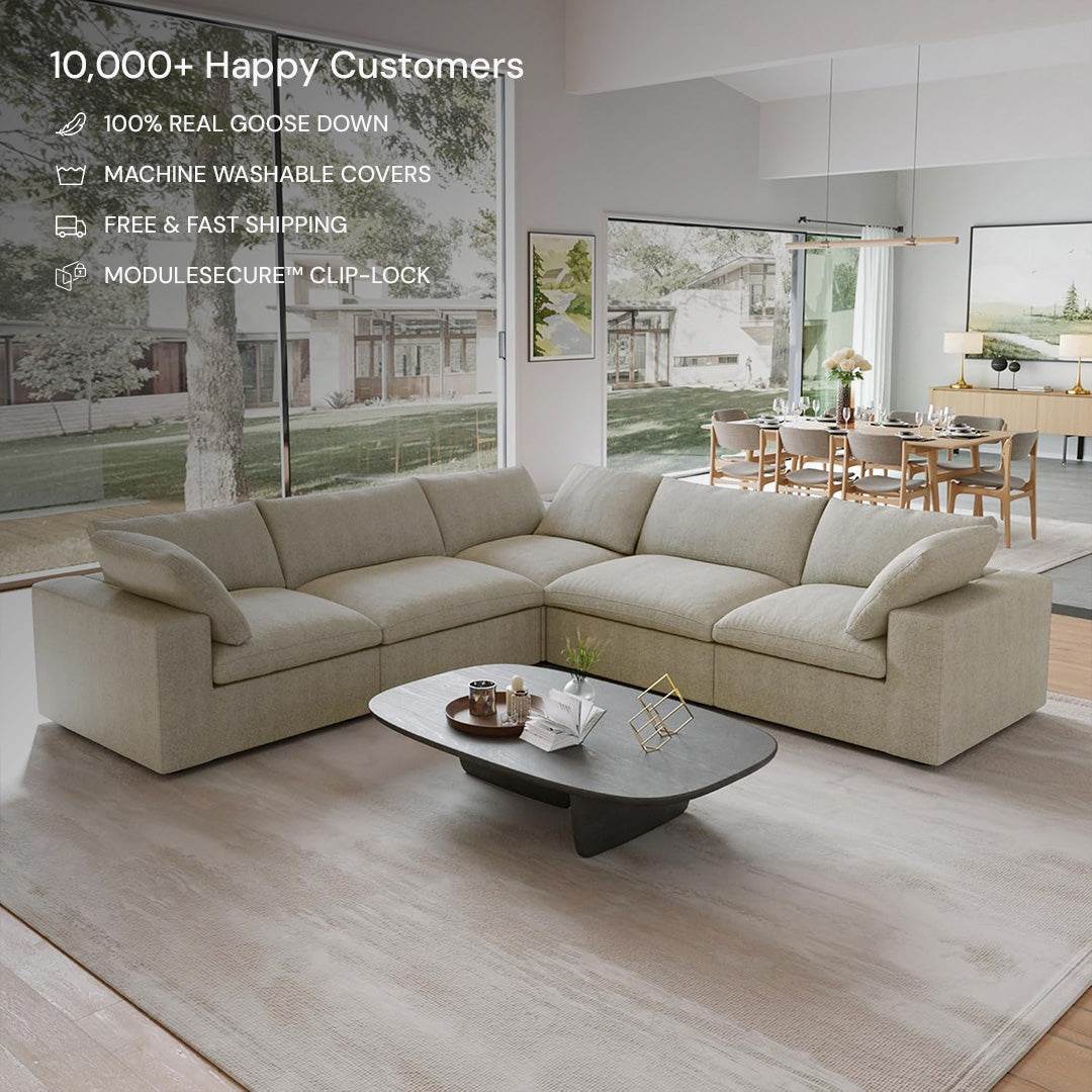 The CloudForm™ 5-Seater Modular L-Sofa in beige features removable fabric covers and sits elegantly in a spacious living room with large windows, a low coffee table, and wall art—customer satisfaction text overlayed.