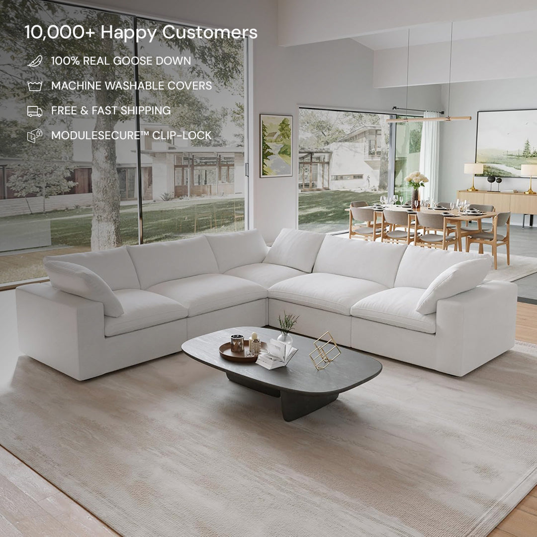 A modern living room features the CloudForm™ 5-Seater Modular L-Sofa in white with removable fabric covers, paired with a low coffee table and floor-to-ceiling windows. Text emphasizes the sofa’s versatility, comfort, and high customer satisfaction.