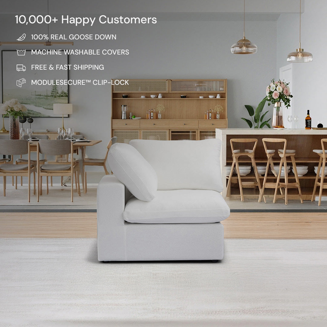 The CloudForm™ Corner Modular Sofa in white, featuring a solid birch wood frame, sits in a modern open-concept dining and living area, with its key features highlighted above.