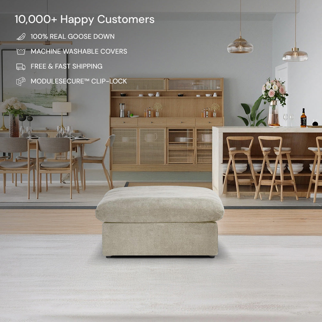 The CloudForm™ Ottoman Modular Sofa in beige, featuring removable fabric covers, sits on a rug in a modern dining and living area with a wooden cabinet, dining table, and product features listed at the top.